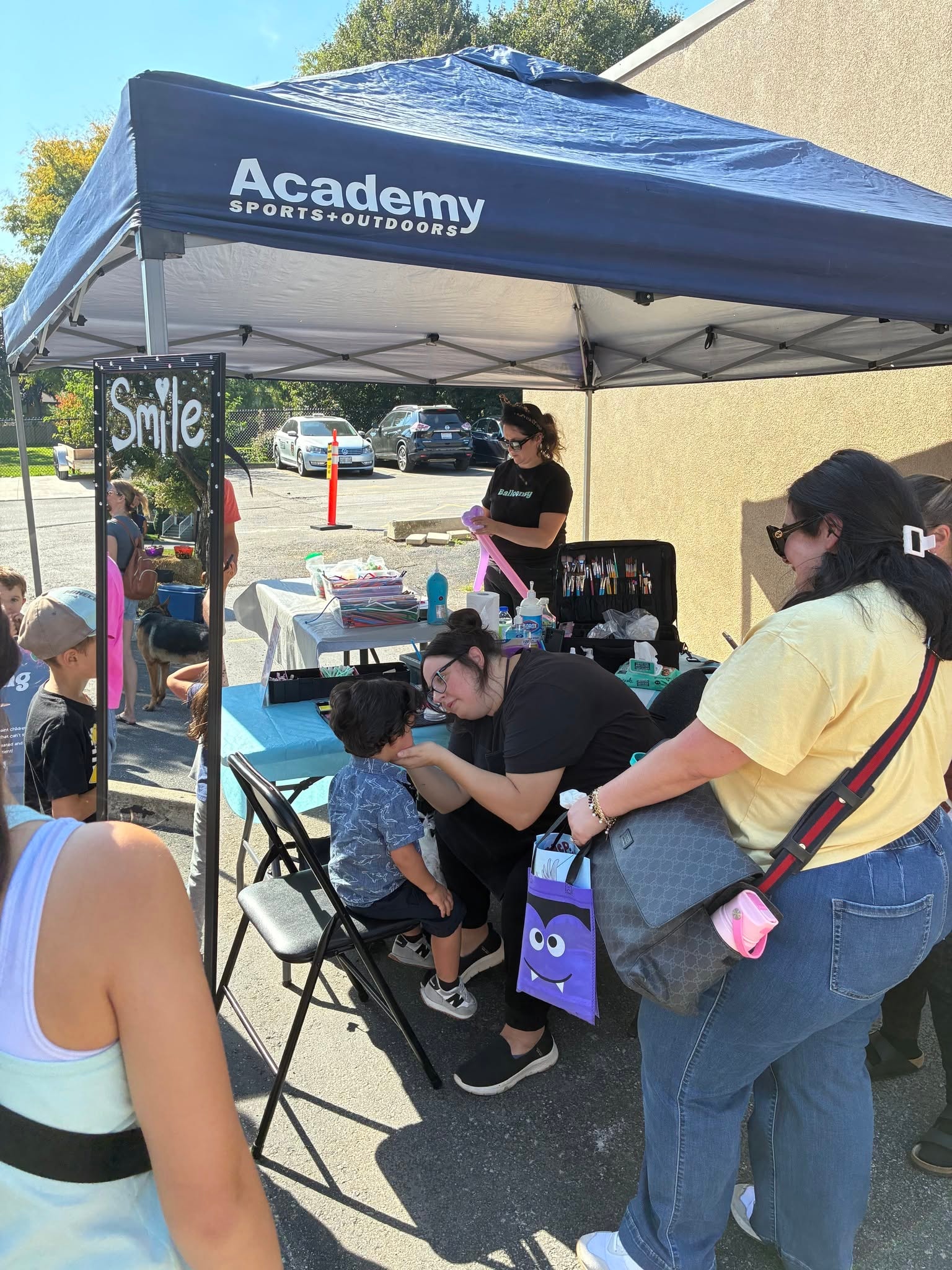 Face painting booth at the Pumpkin Giveaway event