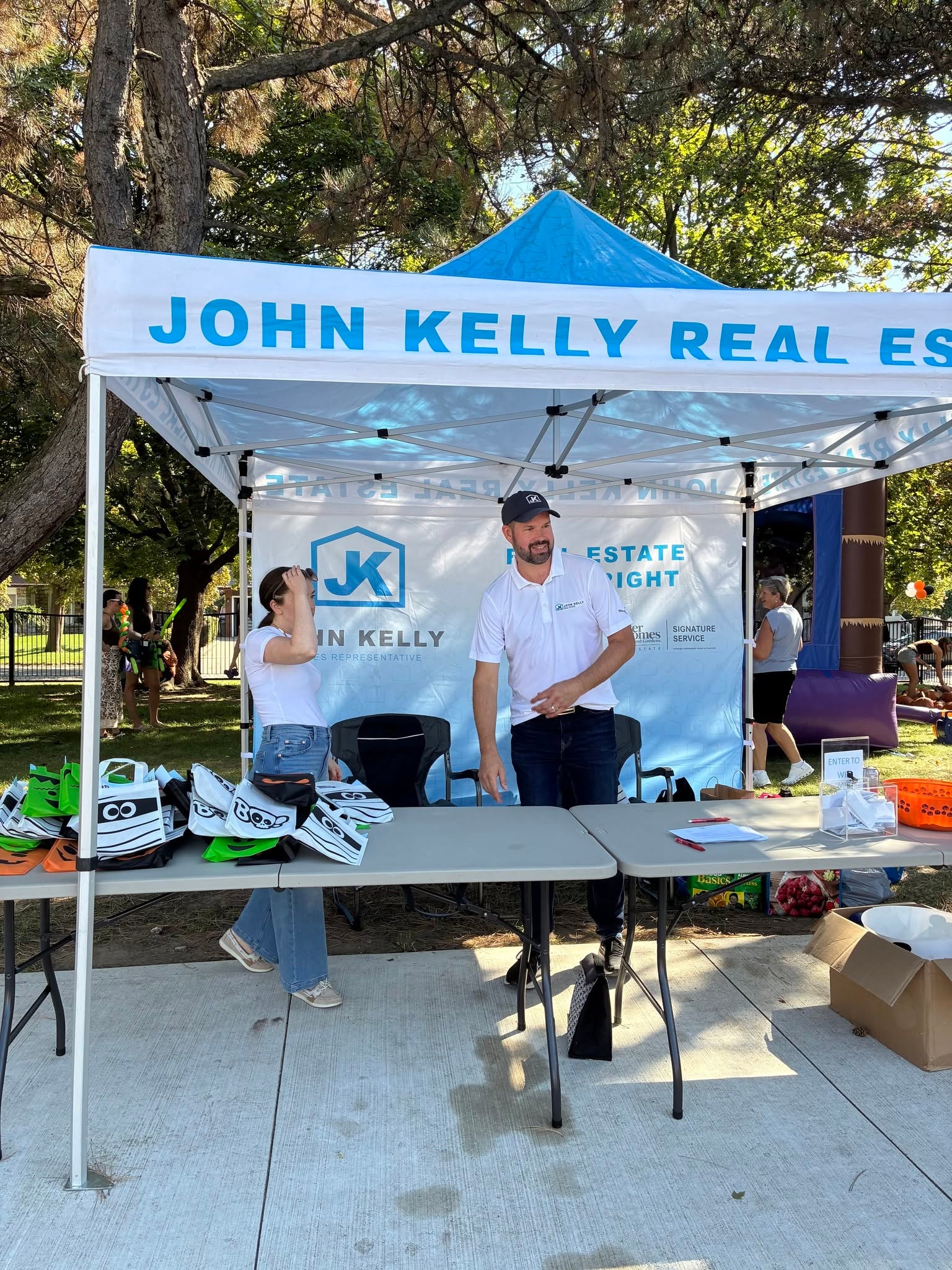 John Kelly Real Estate tent with staff at the Pumpkin Giveaway